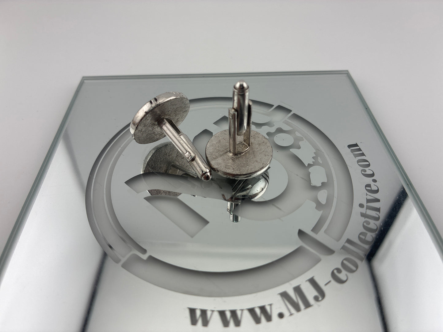 Round silver cufflinks crossed lines