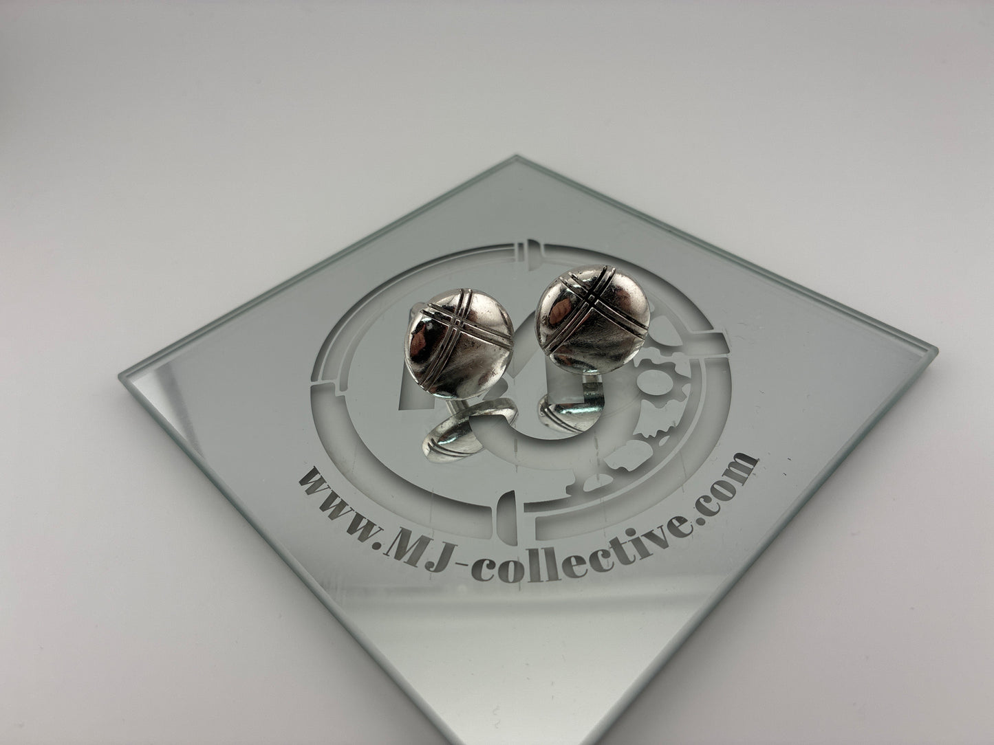 Round silver cufflinks crossed lines