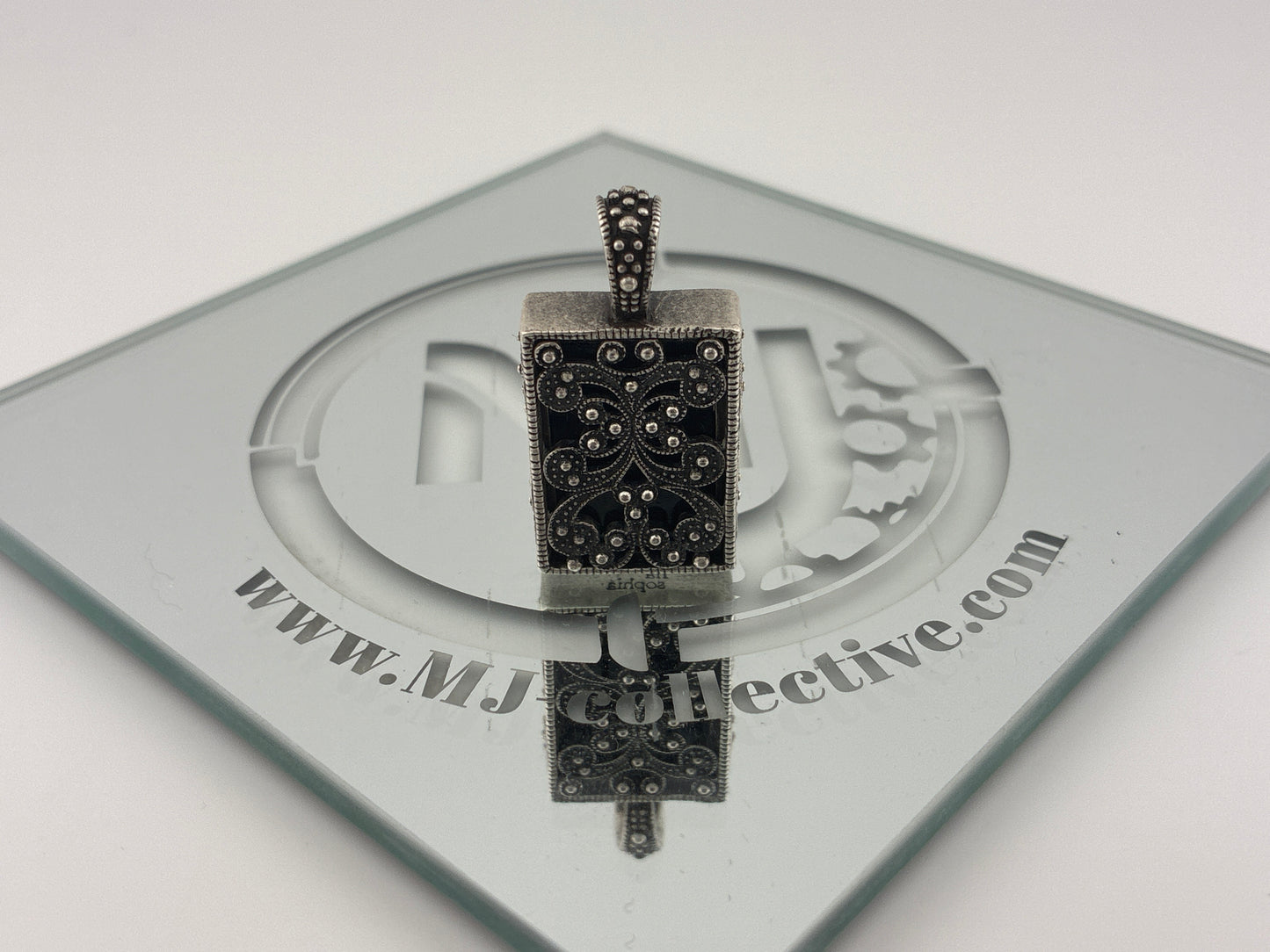 Silver toned charm Lia Sophia